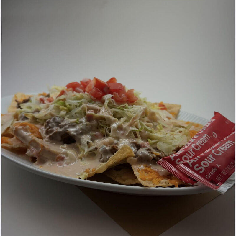 Queso Nachos Supreme w/ 2 sour cream